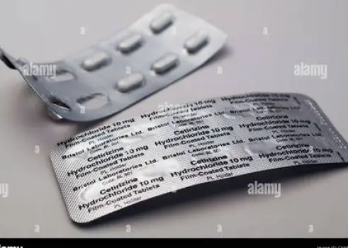 Assorted antihistamine tablets in blister packs on a table