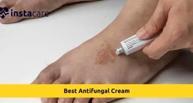 Person applying antifungal cream to the skin of their belly button