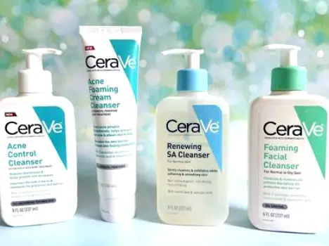 Three CeraVe facial cleanser bottles standing side by side, representing salicylic acid, benzoyl peroxide, and hydrating options