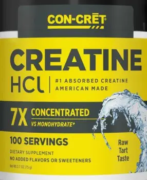 Close-up of dry creatine powder with visible clumps inside an open supplement container