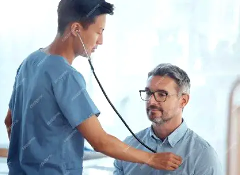 Healthcare professional listening to a patient's lungs with a stethoscope during a respiratory examination