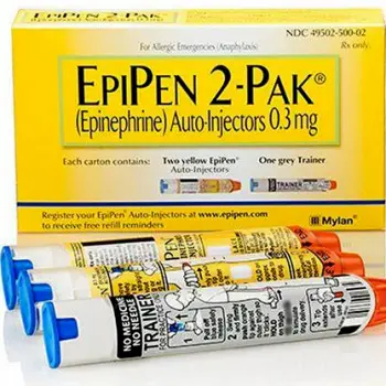 Close-up of an epinephrine auto-injector held in a person's hand