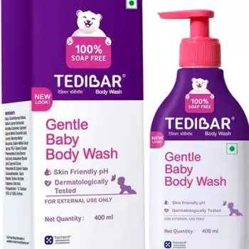 Caregiver gently patting a baby's neck fold dry with a soft cloth after cleansing