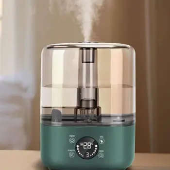 A cool-mist humidifier, a mug of warm tea, and a spoon of honey on a kitchen counter