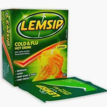 Several Lemsip sachet packets from the cold and flu range displayed side by side, showing different product variants in the brand
