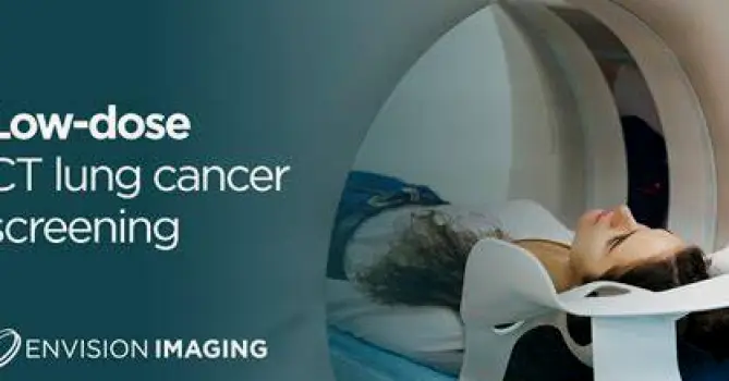 Person lying on a CT scanner table with the chest inside the scanner opening during lung cancer screening