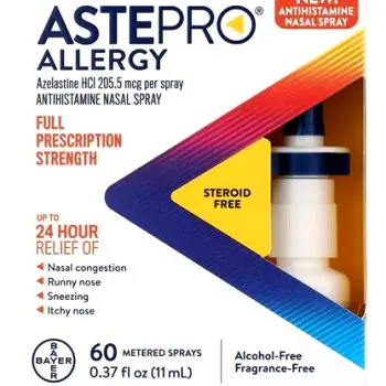 Small nasal antihistamine spray bottle held in a person's hand