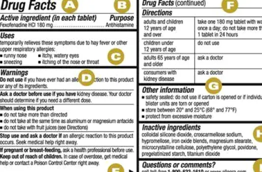 A close-up view of a person's hands holding an over-the-counter medicine package and reading the active ingredients section of the Drug Facts panel