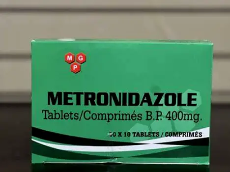 Close view of a metronidazole bottle displaying its prescription label with dosage instructions