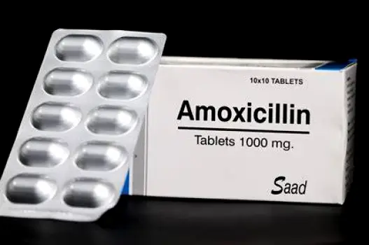Transparent container of metronidazole tablets, representing an antibiotic prescribed for bacterial vaginosis.