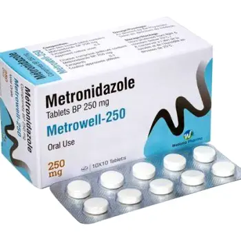 Person swallowing a metronidazole tablet while drinking a glass of water