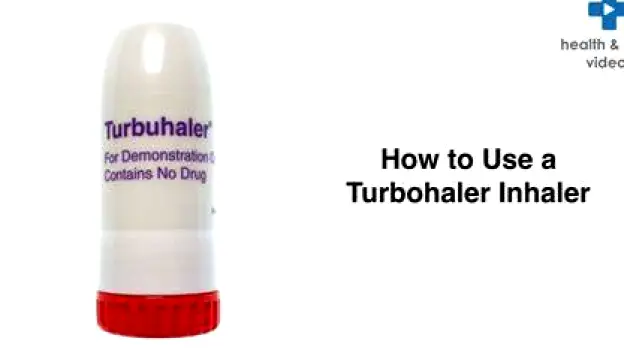 Turbohaler device with red grip turned to click, mouthpiece open, ready for inhalation