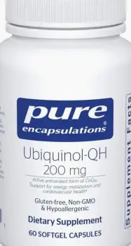 Two open capsules displaying different colored CoQ10 contents side by side on a neutral surface