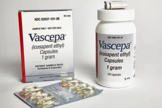 Vascepa capsules placed on a plate beside a meal to illustrate dosing with food